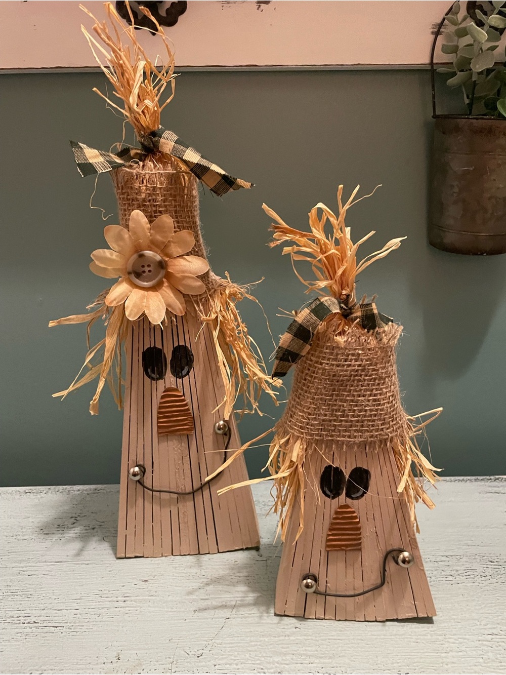 Pair of wooden scarecrows
